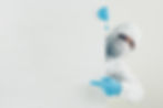 doctor-mask-gloves-protective-suit-pointing-left-looking.jpg