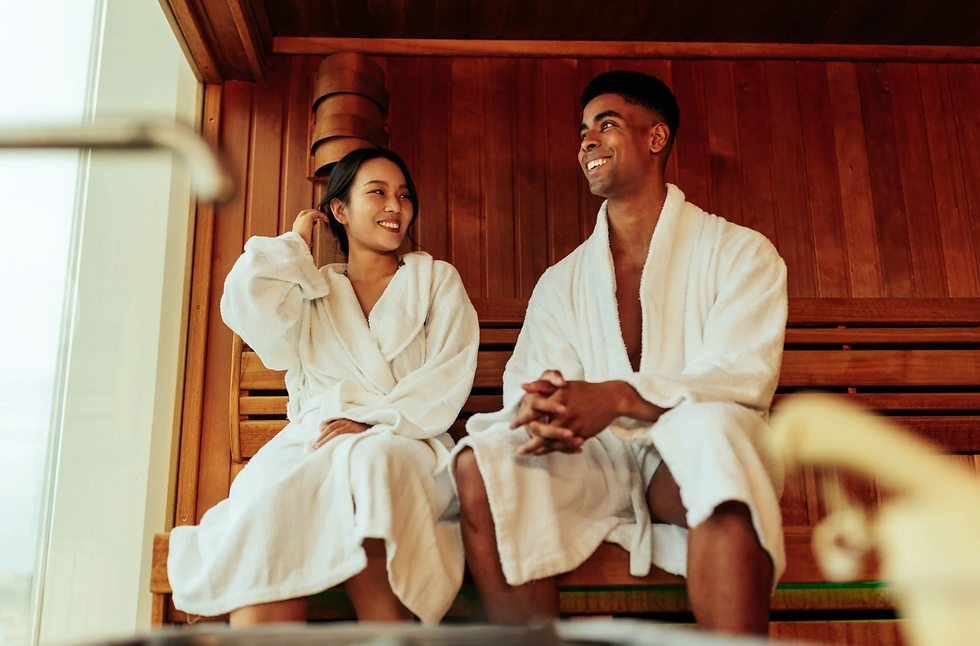 Two people sitting in the infrared sauna in Utah and smiling