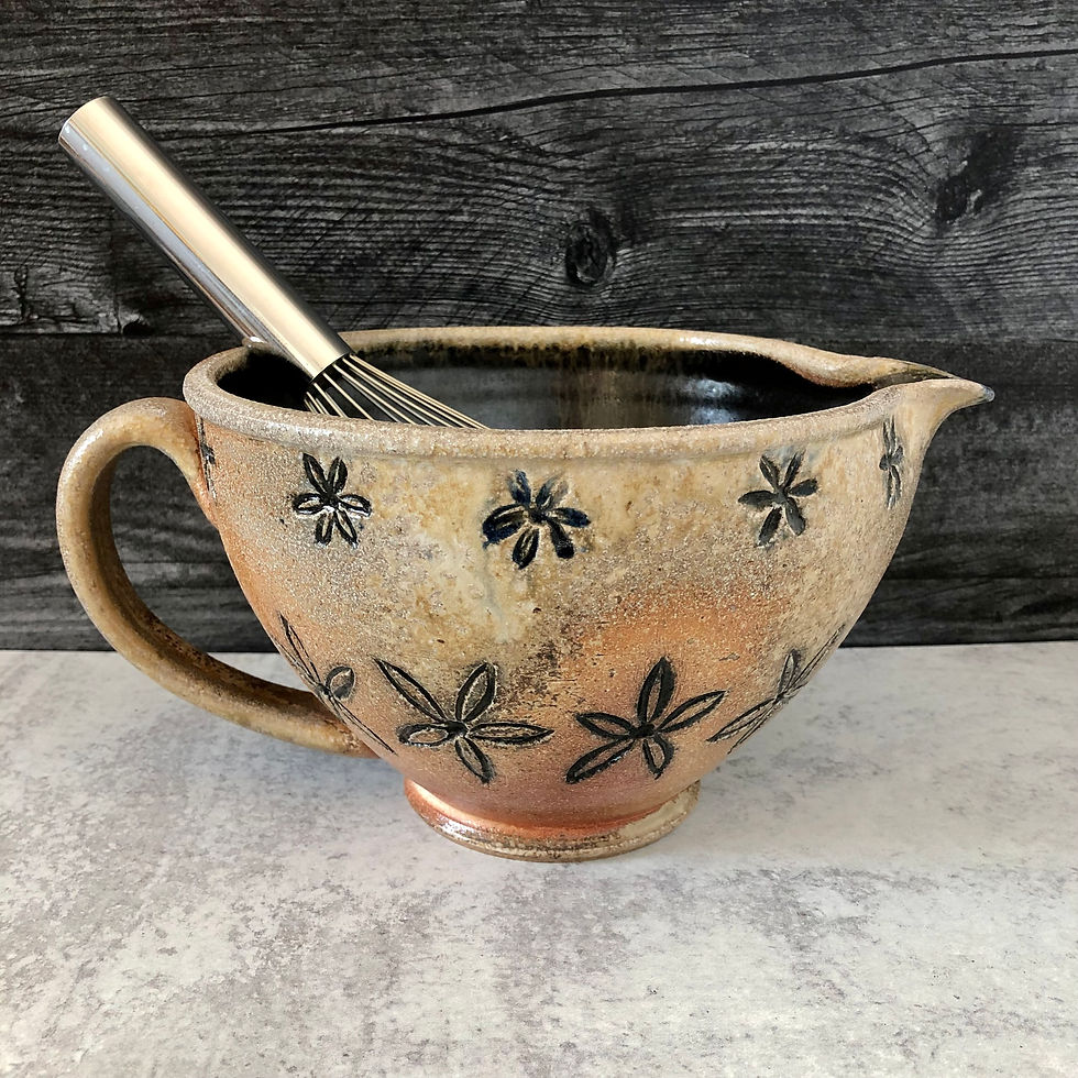 Stoneware batter bowl with carved floral pattern