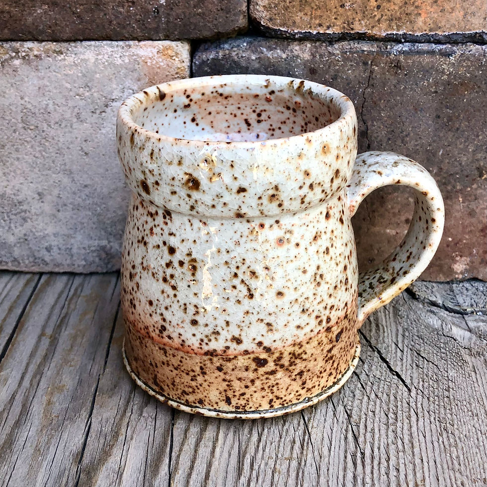 Wild clay infused speckled pottery mug with shino glaze
