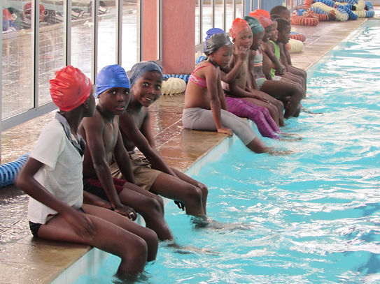 Children in Lesotho getting swimming instructions