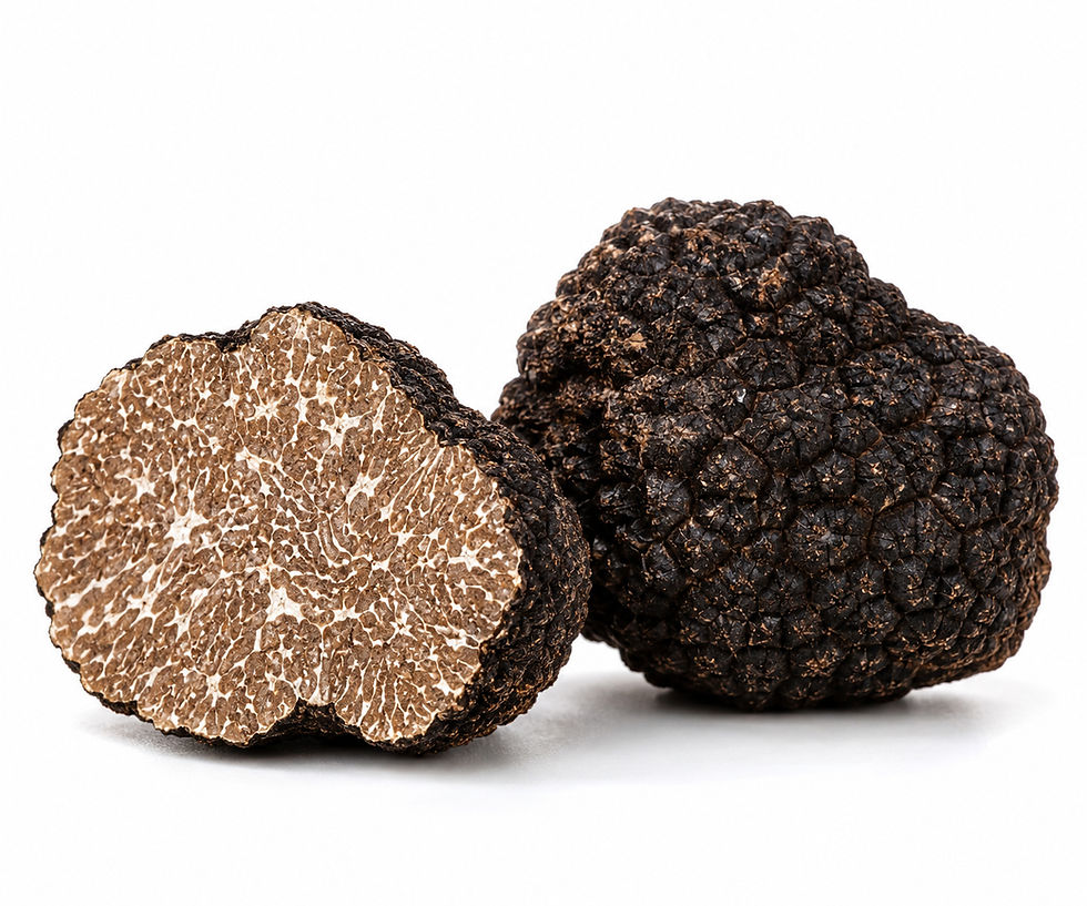 Whole and sliced fresh Black Burgundy Truffles (Tuber uncinatum) showing their distinctive dark exterior and marbled interior