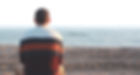 Man staring out to the sea, reflecting on life after therapy session