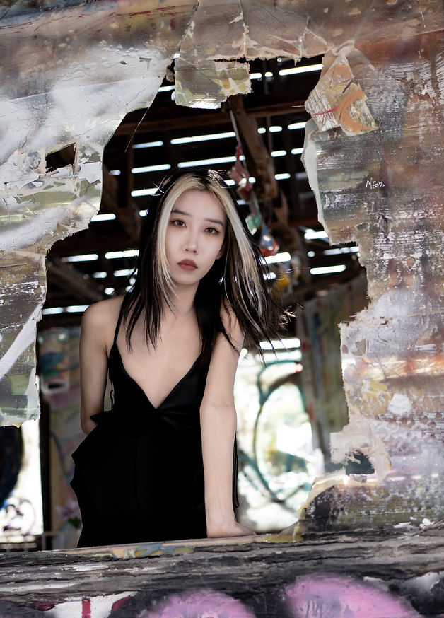 Color editorial portrait of woman in front of mural by Elin Shu, Los Angeles photographer