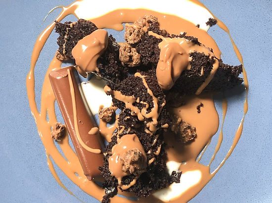 overhead view of a chocolate dessert messily composed with fun chocolate swirls and dollops of chocolate here and there from Tastings private chef Austin