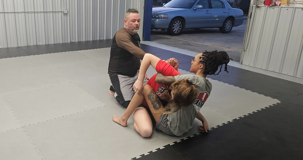 Women's Jiu Jitsu training session with an instructor