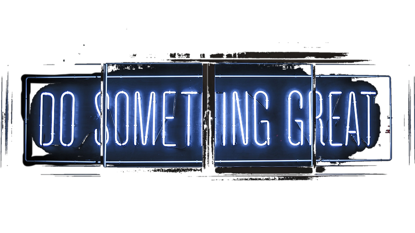 Do Something Great words in neon shine through the glass - sits behind our projects