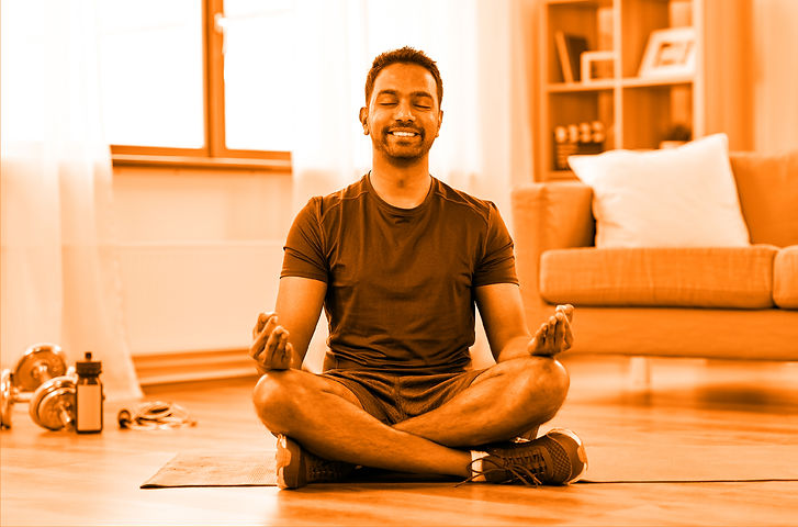 Man sat on floor in relaxed yoga pose for mens health section of 4U health hub