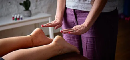 4U Pilates owner Zoisa Holder providing a Reiki treatment