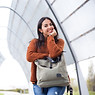jolly-young-woman-leaning-handbag-city-park.jpg