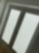 Light grey pleated blinds on a uPVC door