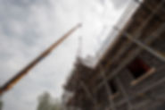 A scaffold with a building under construction below