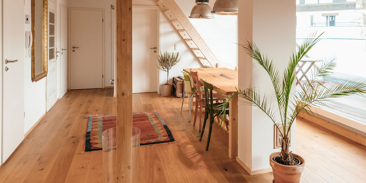 Bright, cosy interior with a wooden floor