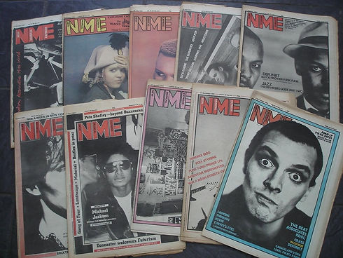 This image shows a collection of vintage NME (New Musical Express) music newspapers from the late 1970s and early 1980s