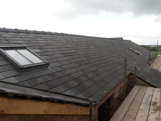ailed view of high-quality slate roof tile placement during installation