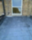 British flat roof with grey slate roof tiles