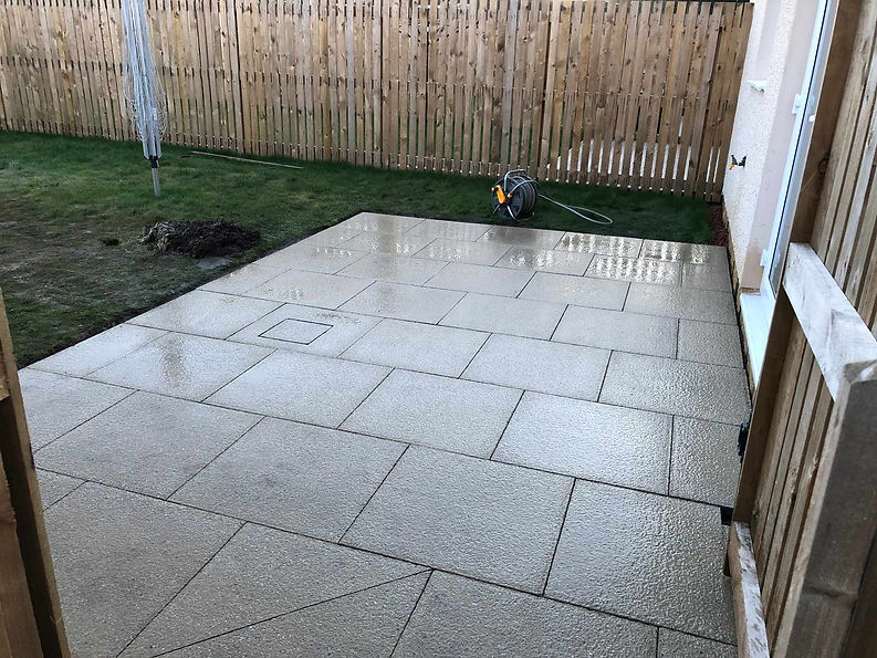 Wet garden patio after being layed