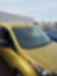 Yellow car parked outside after professional vehicle glass repair
