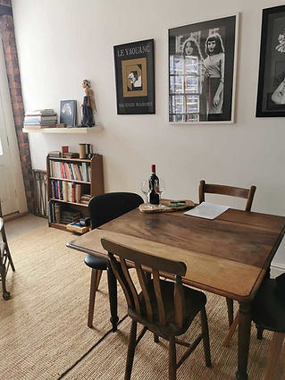 A dining room with a wooden table set