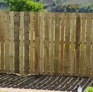 Wooden fence with vertical slats