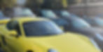 Yellow sports car receiving expert windscreen replacement