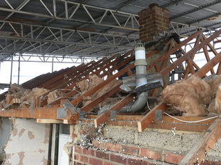 A residential roof under demolition