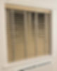Close up of natural wood Venetian blinds with tapes