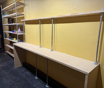 Wall mounted wooden shelving unit installed over a radiator
