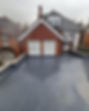Flat roof that has been refurbished with a grey rubber covering