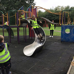 children on a slide in a park
