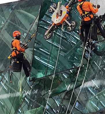 High rise glazing via rope access