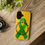 Miniature : A yellow phone case features a green awareness ribbon surrounded by the words “Silent Rebel. Embrace Your New View.” The case