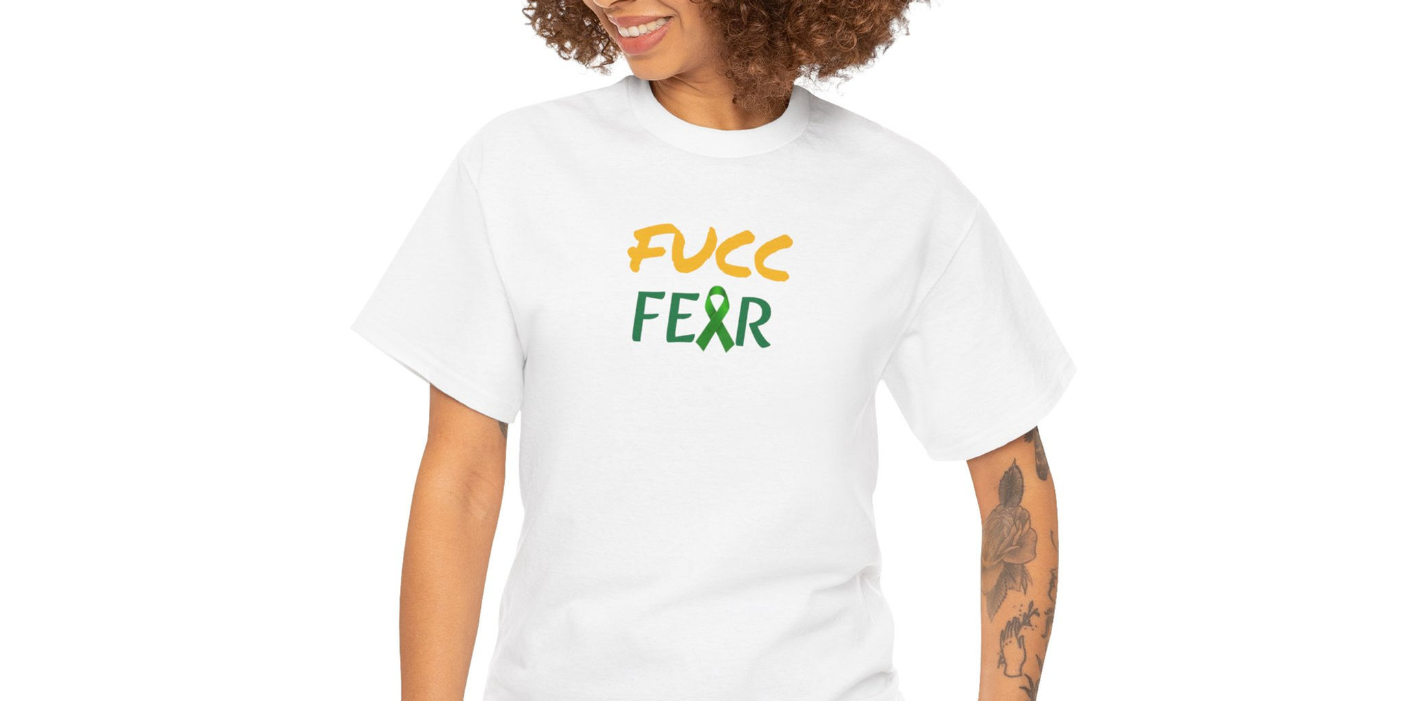A person wears an white shirt with the bold phrase “FUCC FEAR” printed across the chest. The word “FUCC” is in yellow, green