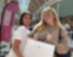 Student-shopper-sweep-women-holding-Apple-shopping-bag.jpg