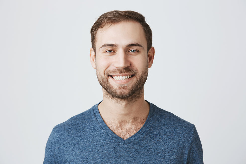 Smiling man in blue shirt