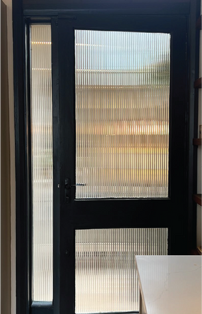 a nice textured window film in cambridge on their back door