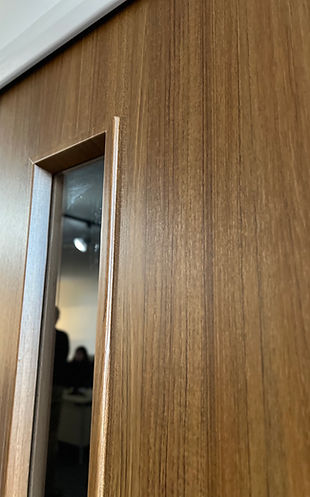 Fire door wrapped in 3m dinoc architectural film by Velfi Interiors