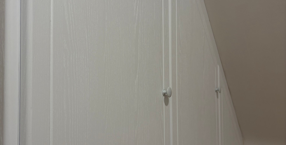 White Wood effect vinyl wrap on wardrobe in cambridge by velfi interiors