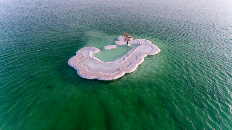 a small island in the middle of a body of water