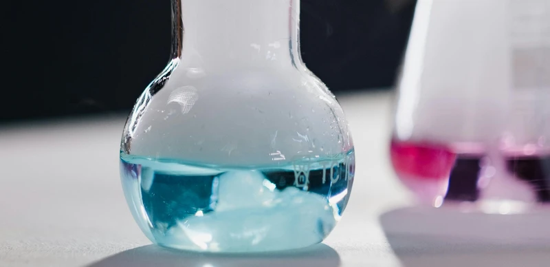 a beaker with a blue liquid in it