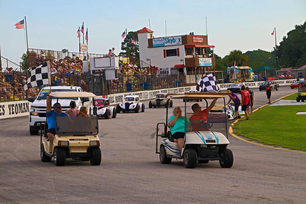 A ceremonial victory lap is held prior to the start of the ClarkCo Construction Summer Thunder racing program in honor of longtime speedway flagman Leon Burrow. (Andy Marquis/Honey Badger Entertainment photo)