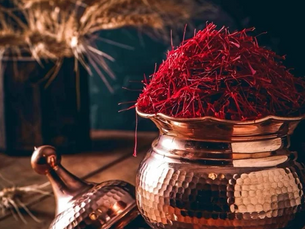 Adhyat Saffron full threads in a glass jar, hand-harvested in Pampore Valley, Kashmir, known for deep crimson color and rich aroma.