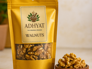Adhyat Premium Kashmiri Walnuts golden halves in a glass jar, hand-cleaned and hygienically packed for purity and freshness.