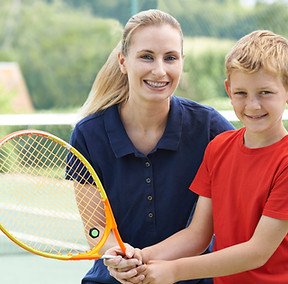Boy with Tennis Coach