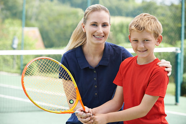 Boy with Tennis Coach