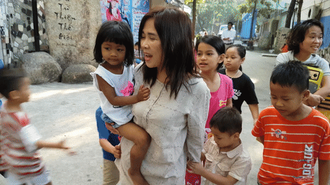 Mother-Huynh-Tieu-Huong-walking-Children.gif
