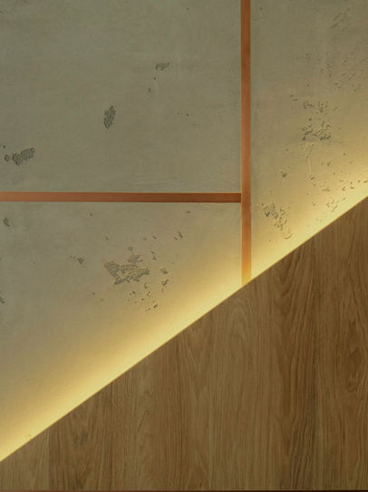 Modern wall design with concrete panels and wood accents