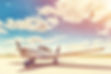 Propeller plane parking at the airport. Sunny day..jpg