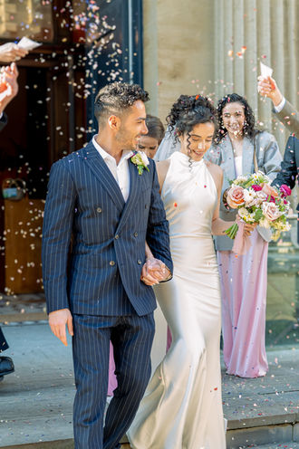 Couple laughing together during candid portraits at Hertfordshire manor wedding, photographed by Win.Co Photography, showing natural emotion and love.