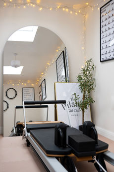 Professional photography of Pilates studio opening, highlighting modern equipment and space